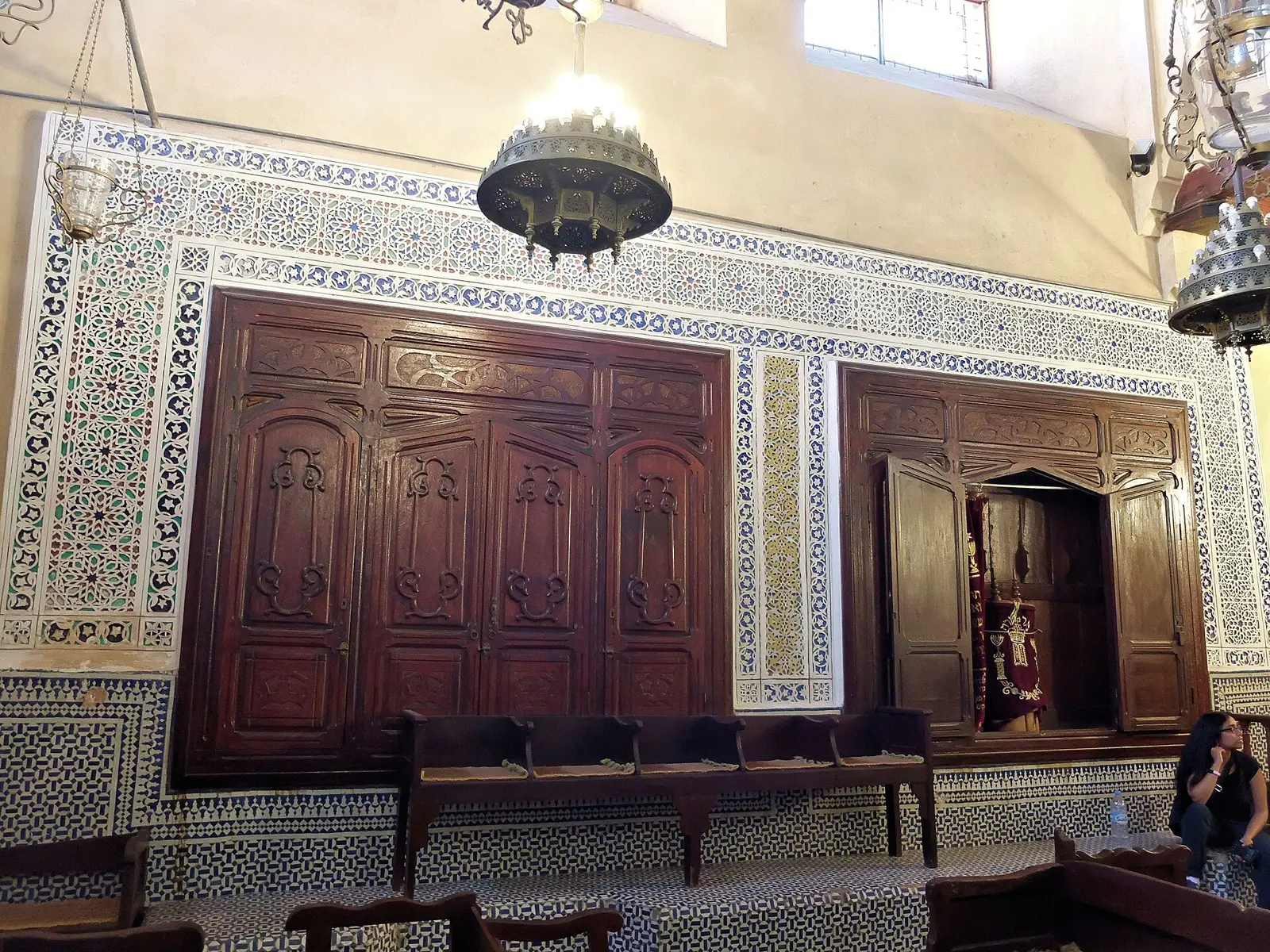 Carved wooden ark and zellige walls inside the Ibn Danan Synagogue in the Mellah of Fes
