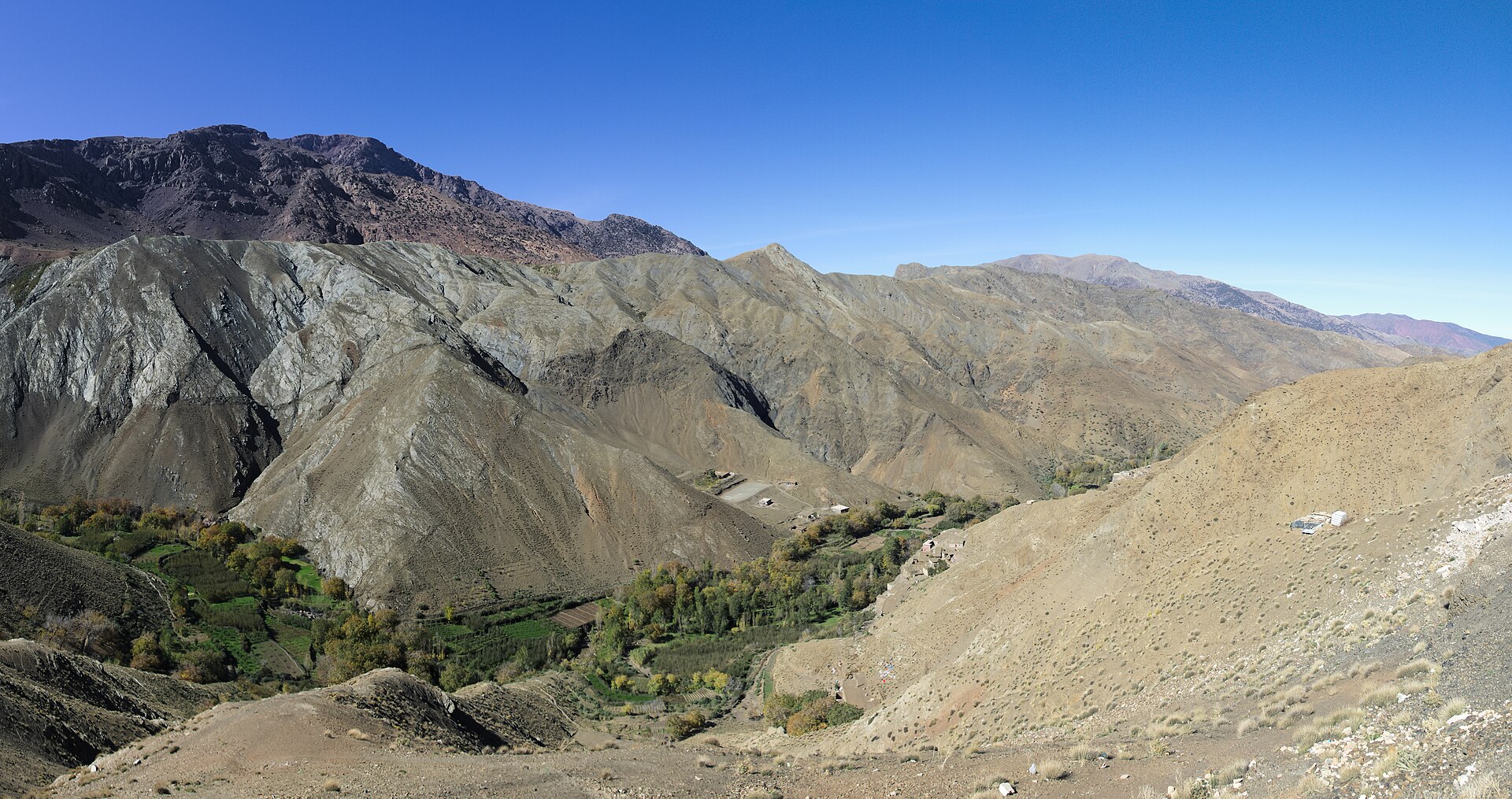 Switchback road climbing through bare mountain ridges at the Tizi n'Tichka pass in the Moroccan High Atlas
